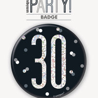 black badge with a prismatic 30 print