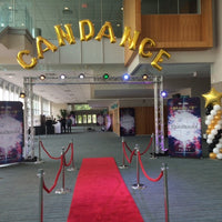 large gold foil balloon letters spelling out candance