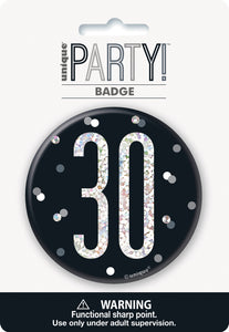black badge with a prismatic 30 print