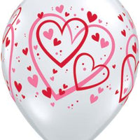 11" clear balloon with red and pink heard pattern
